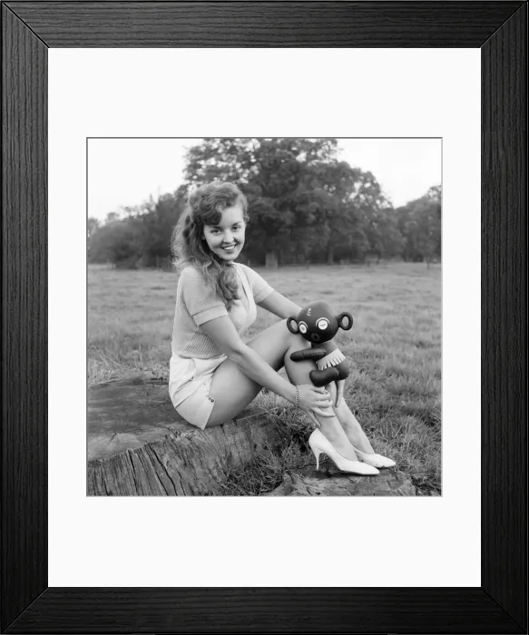 Framed Print : Model Kim Pearson seen here with inflatable alien toys. 1962 E422-005 Framed Print : Model Kim Pearson seen here with inflatable alien toys. 1962 E422-005