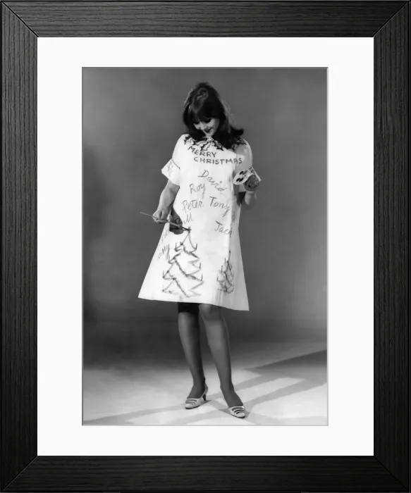 Framed Print : Reveille Fashions: Joanne Young decorating her own christmas dress. December 1966 P006647 Framed Print : Reveille Fashions: Joanne Young decorating her own christmas dress. December 1966 P006647