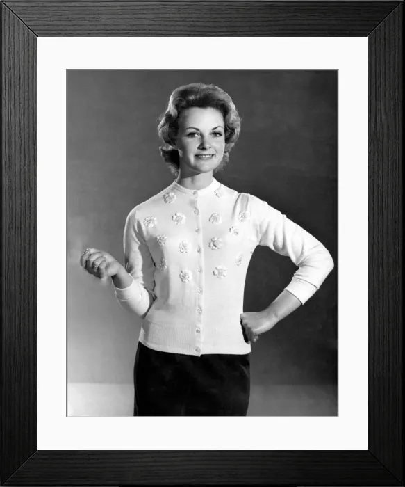 Framed Print : Reveille Fashions. Roma Reeves modeling a cardigan with embroided flower detail Framed Print : Reveille Fashions. Roma Reeves modeling a cardigan with embroided flower detail
