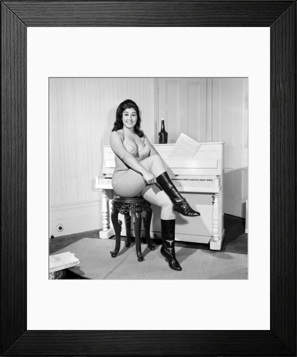 Framed Print : Large chested Denise Crooke seen here banging out a tune on the piano. 1965