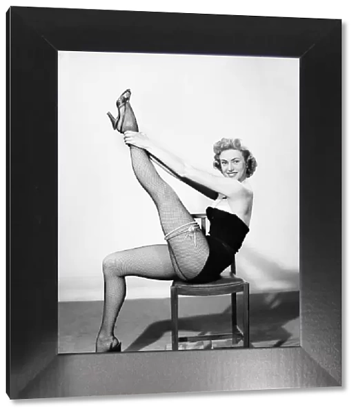 Model wearing garter and stockings. 1962
