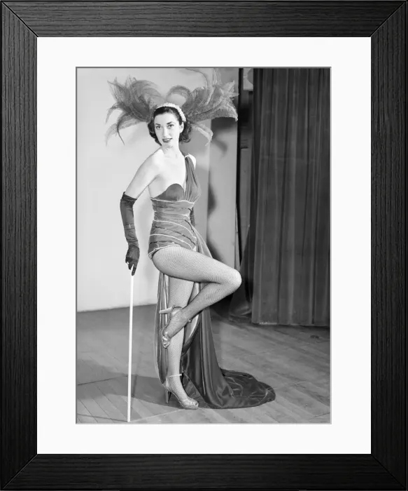 Framed Print : Show girl in costume seen here on stage. 1966