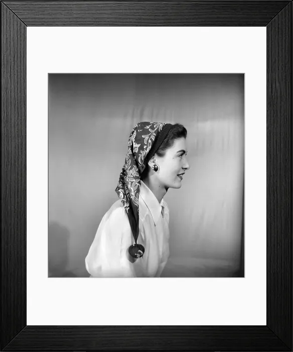 Framed Print : Woman modeling several ways of wearing a head scarf. April 1953