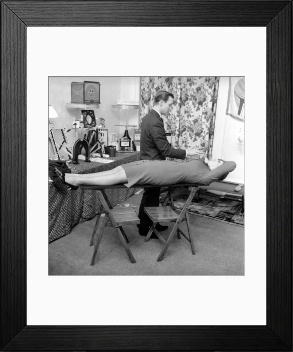 Framed Print : Magician Bernard Hughes: Performing a levitation trick on his female assistant Framed Print : Magician Bernard Hughes: Performing a levitation trick on his female assistant