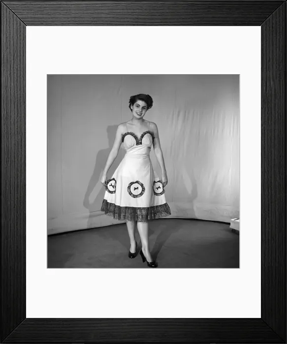 Framed Print : Woman modelling the latest evening dress fashions in the Reveille studios Framed Print : Woman modelling the latest evening dress fashions in the Reveille studios