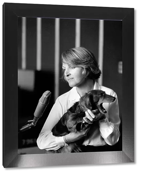 Actress Penelope Keith makes a record about a Dachsund dog. June 1980 80-03067