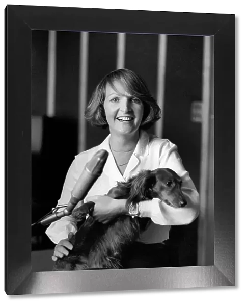 Actress Penelope Keith makes a record about a Dachsund dog. June 1980 80-03067-008