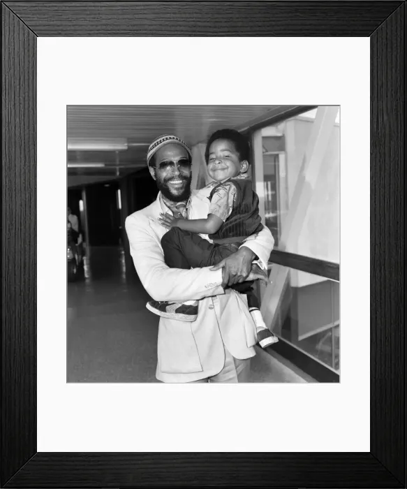 Framed Print : Marvin Gaye, singer with his son Frankie, aged 4, arriving at London Heathrow Airport Framed Print : Marvin Gaye, singer with his son Frankie, aged 4, arriving at London Heathrow Airport