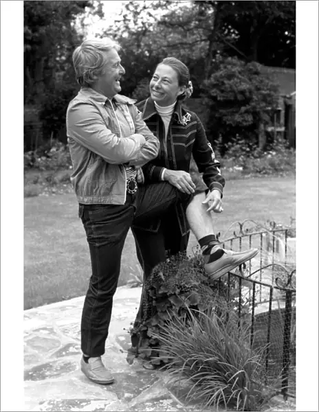 British comedian Ernie Wise showing off his fat hairy legs to his wife. June 1980