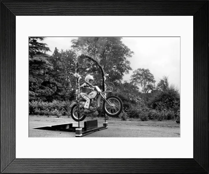 Framed Print : Boy Stunt Rider: 6 year old Darius Goodwin is pictured here leaping through flames for Framed Print : Boy Stunt Rider: 6 year old Darius Goodwin is pictured here leaping through flames for