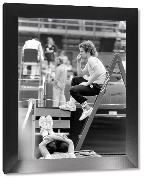 John McEnroe, with a foot bandaged and leather support seen here during training running
