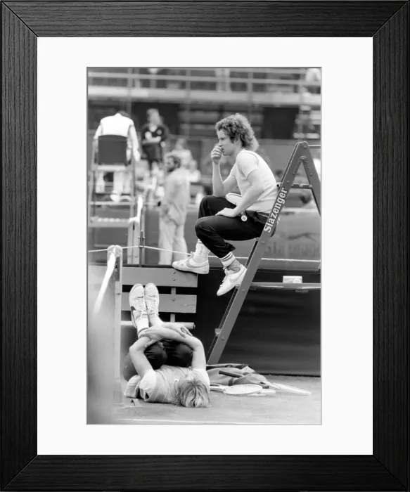 Framed Print : John McEnroe, with a foot bandaged and leather support seen here during training running
