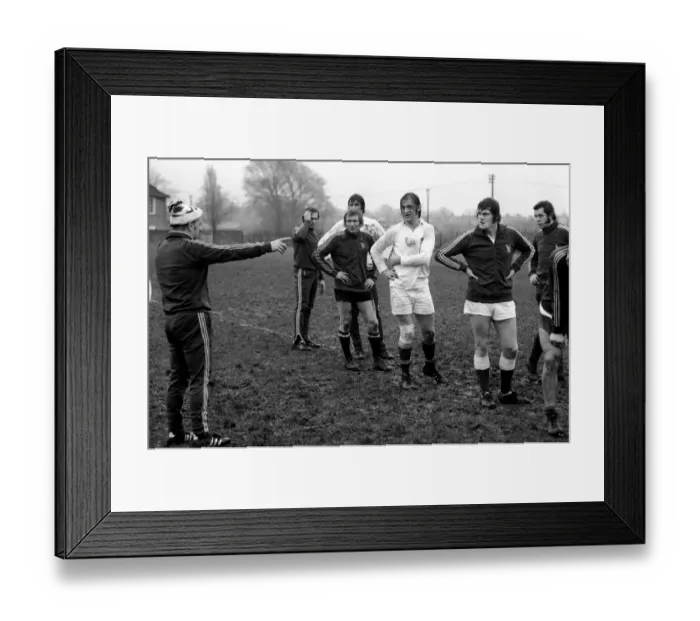 Framed Print : England Rugby team training at Twickenham. Coach John Burgess during a talk with players