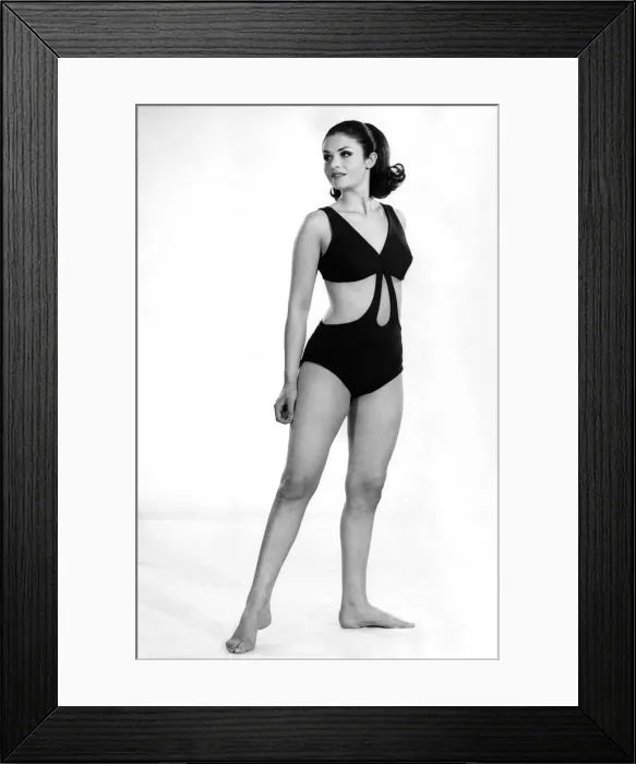 Framed Print : Reveille Fashions: Peak-a-boo. A giant tear-drop cut-out at centre