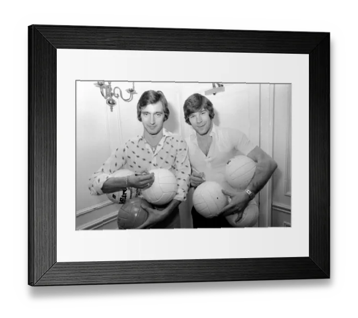 Framed Print : England team at hotel: Alan Hudson left and Malcolm MacDonald sign match footballs Framed Print : England team at hotel: Alan Hudson left and Malcolm MacDonald sign match footballs