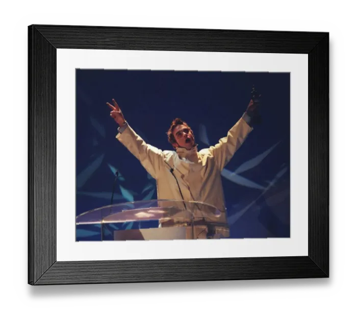 Framed Print : Robbie Williams formerly of Take That presenting an award at the Brit Awards 1996