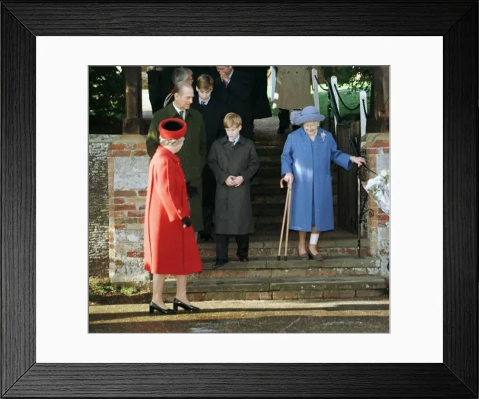 Framed Print : Prince Philip and the Queen watch as the Queen Mother walks down steps at Sandringham