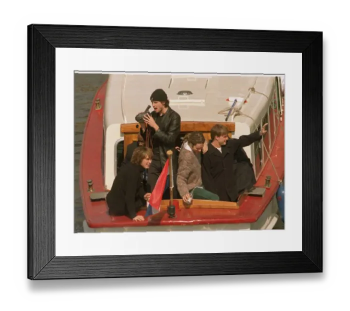 Framed Print : Take That in the Netherlands after their final concert, leaving on a canal tazi as fans