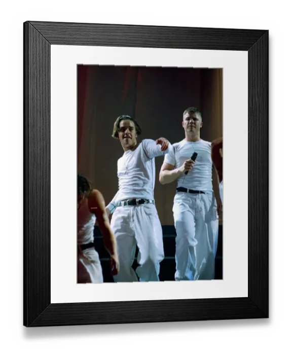 Framed Print : Robbie Williams and Gary Barlow of Take That on stage at their concert in Manchester