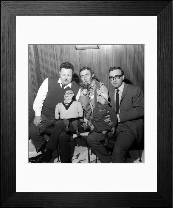 Framed Print : The Goons. Harry Secombe, Spike Milligan and Peter Sellers holding the tellygoons puppets