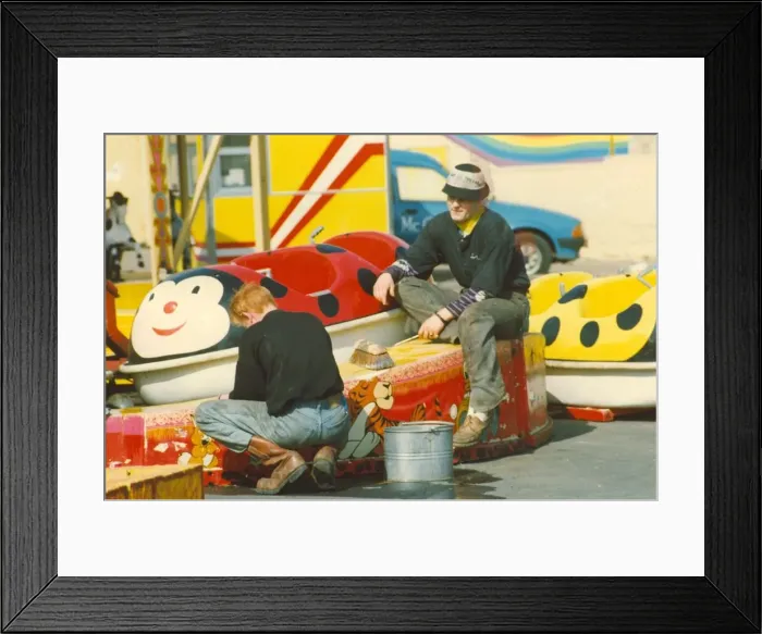 Framed Print : The Spanish City amusement park in Whitley Bay - member of staff getting ready for