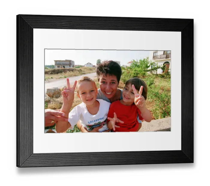 Framed Print : Aid worker Sally Becker pictured in Bosnia with children during war in Yugoslavia