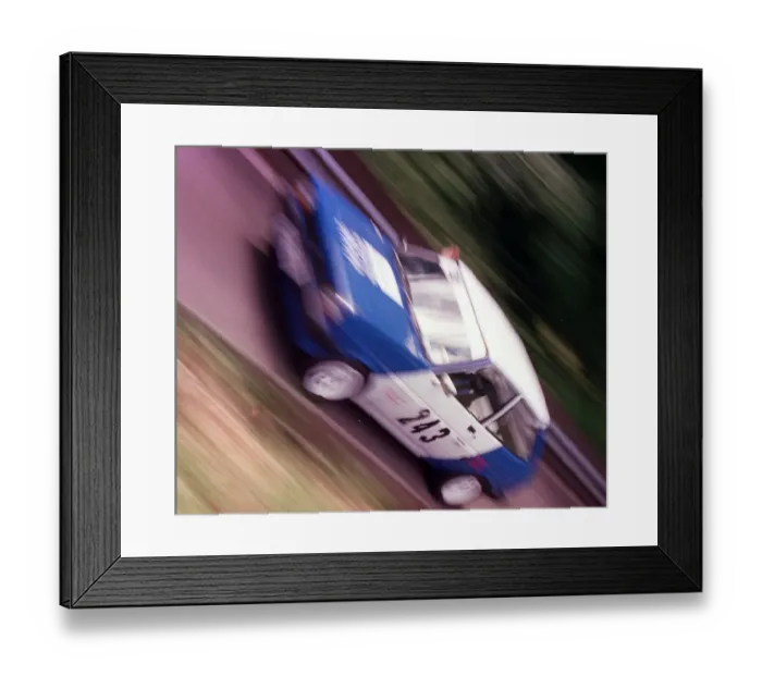 Framed Print : Brian Park races his Ford Fiesta rally car up a hill at Doune