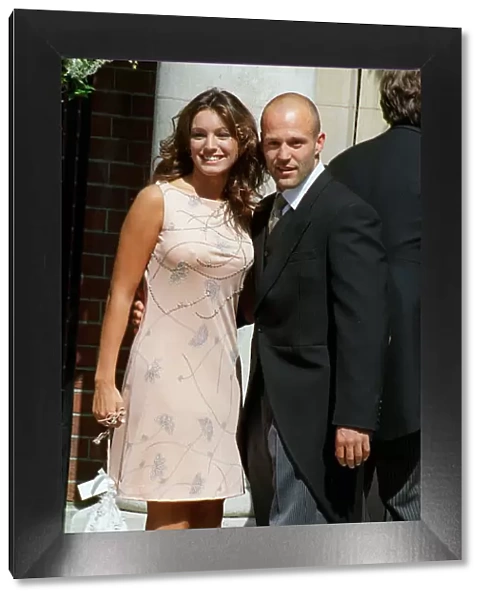 Kelly Brook and boyfriend Jason Statham attend the wedding of Big Breakfast