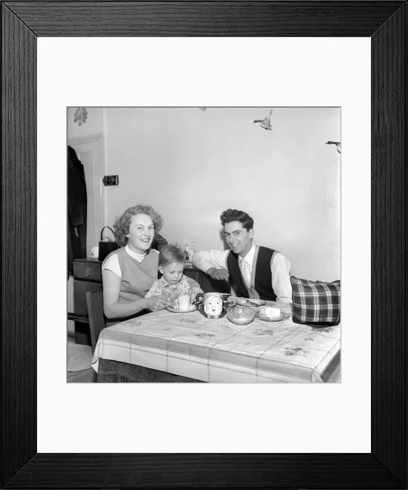 Framed Print : Family life: Mr. and Mrs. Hull giving their son his tea. 1954 A160-002