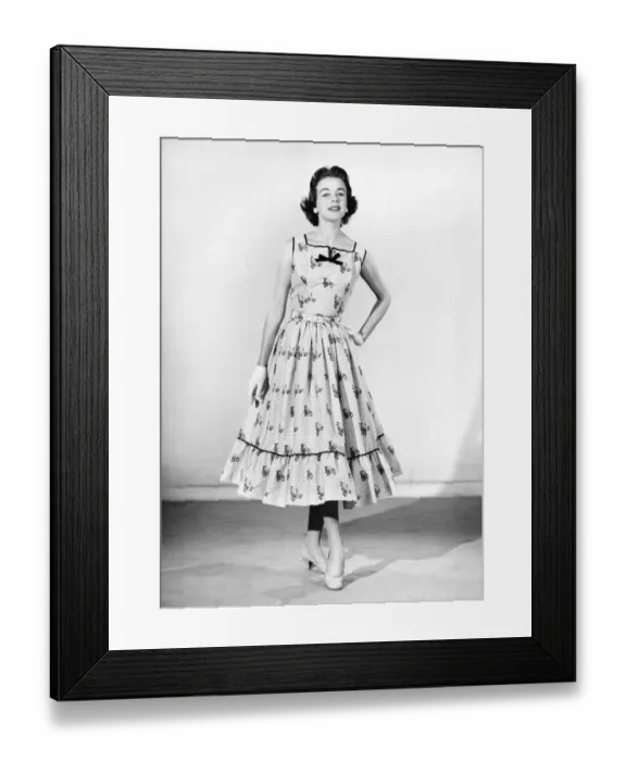 Framed Print : Clothing: Fashion: Dresses. Woman wearing full length dress with matching gloves