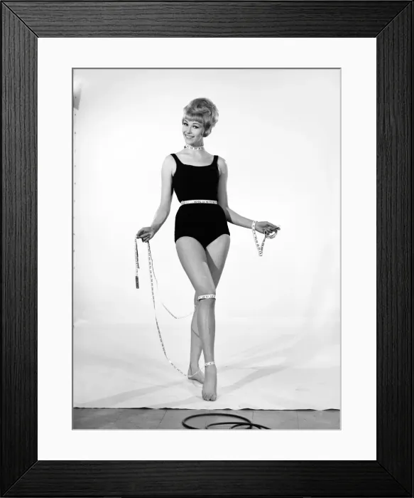 Framed Print : Clothing: Fashion: Beachwear. Woman wearing swimming costume and tape measure. 1960 B1614 Framed Print : Clothing: Fashion: Beachwear. Woman wearing swimming costume and tape measure. 1960 B1614