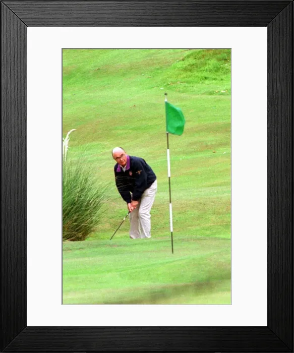 Framed Print : Joe Lewis playing golf July 1997 pitch and putt at the Turnberry Hotel course
