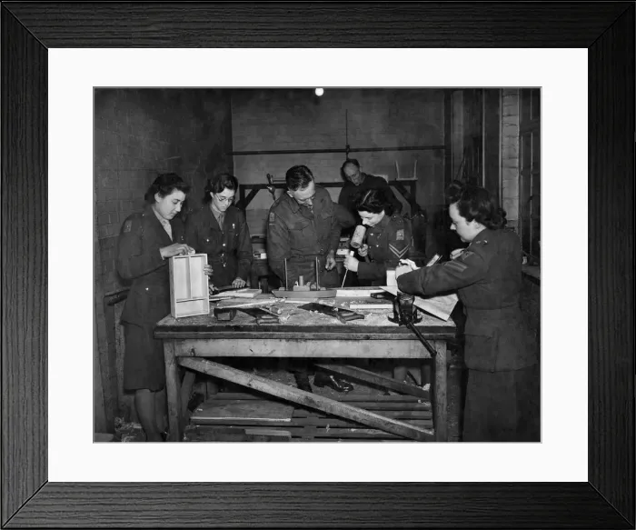 Framed Print : A. T. S. furniture factory. Lt. Archard (Centre) teaching his class the art of woodworking Framed Print : A. T. S. furniture factory. Lt. Archard (Centre) teaching his class the art of woodworking