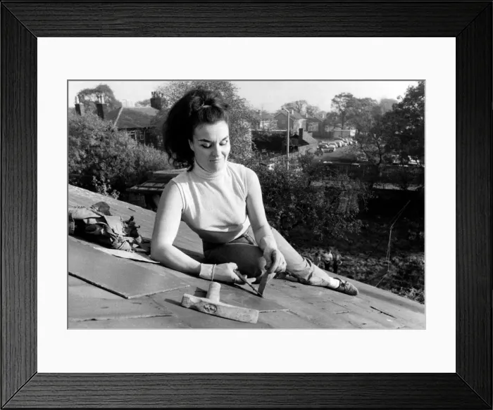 Framed Print : Joyce Peate, at work, high on a rooftop. October 1969 P007860 Framed Print : Joyce Peate, at work, high on a rooftop. October 1969 P007860