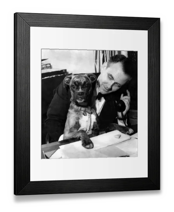 Framed Print : Mr. Marshall speaks on the telephone. Tina looks on. January 1959 P007296