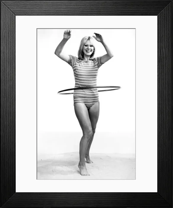 Framed Print : Woman performing slimming exercises using a hula hoop. Circa 1969 P007919 Framed Print : Woman performing slimming exercises using a hula hoop. Circa 1969 P007919