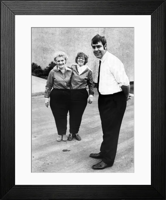 Framed Print : The new slimline Hugh. In the background his sister Diane (left