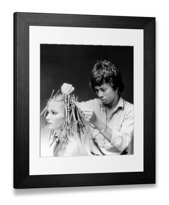 Framed Print : Hairdresser Allan Soh demonstrates the Chinese perm. June 1981 P007893