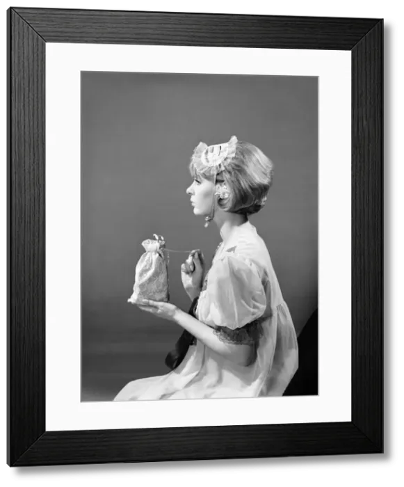 Framed Print : Model Dawn Chapman wearing face mask to aid her in getting a good nights sleep. 1962