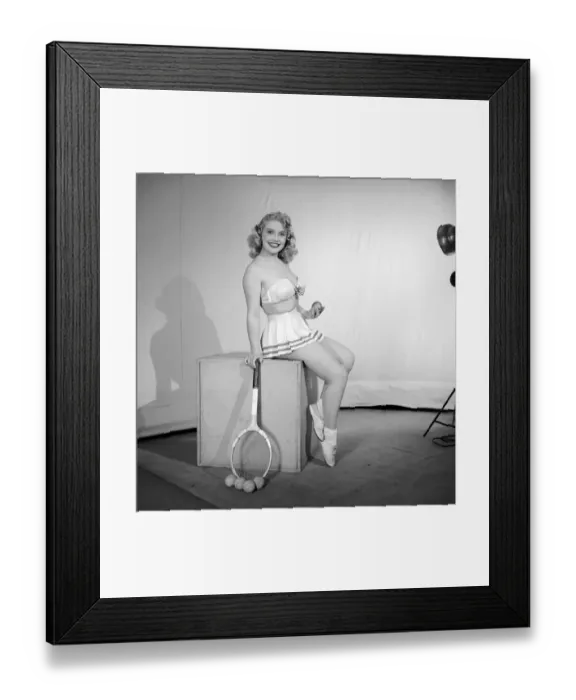 Framed Print : Anyone for tennis? Woman wearing bra, skirt holding tennis racket. 1959 Framed Print : Anyone for tennis? Woman wearing bra, skirt holding tennis racket. 1959
