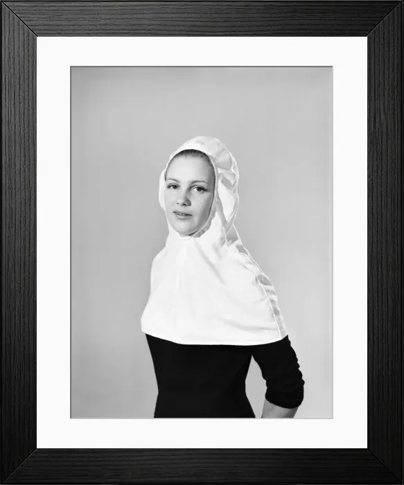 Framed Print : Model wearing hat that can be converted into a hooded cape. 1959 B1685-004 Framed Print : Model wearing hat that can be converted into a hooded cape. 1959 B1685-004