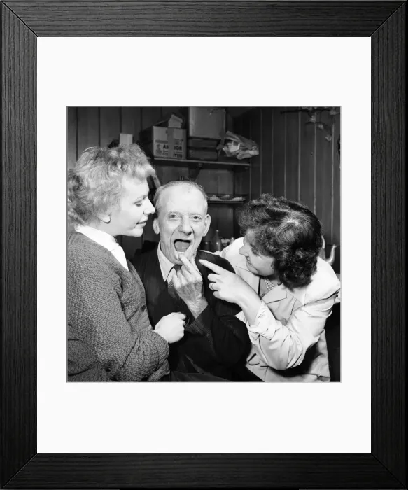 Framed Print : Pensioner with a new tooth. 77 year old man (George Berry) shows off his new tooth Framed Print : Pensioner with a new tooth. 77 year old man (George Berry) shows off his new tooth