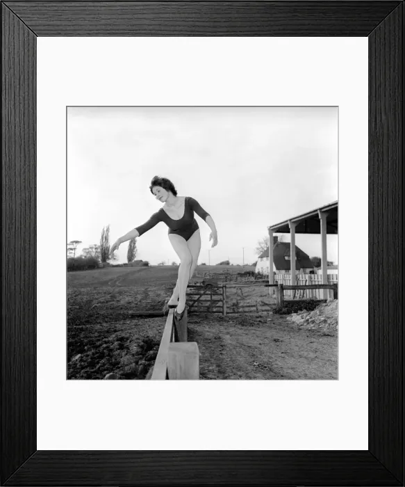 Framed Print : Dancing on the farm Ballerina Gillian Brodie seen here performing on fence posts Framed Print : Dancing on the farm Ballerina Gillian Brodie seen here performing on fence posts