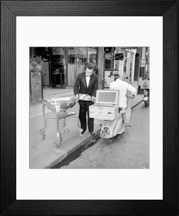 Framed Print : Meals on Wheels: The head waiter of the Romains Buttery loads up the restaurants Framed Print : Meals on Wheels: The head waiter of the Romains Buttery loads up the restaurants