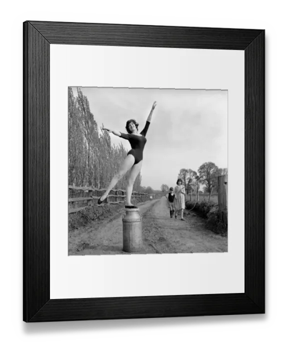 Framed Print : Dancing on the farm Ballerina Gillian Brodie seen here performing on fence posts