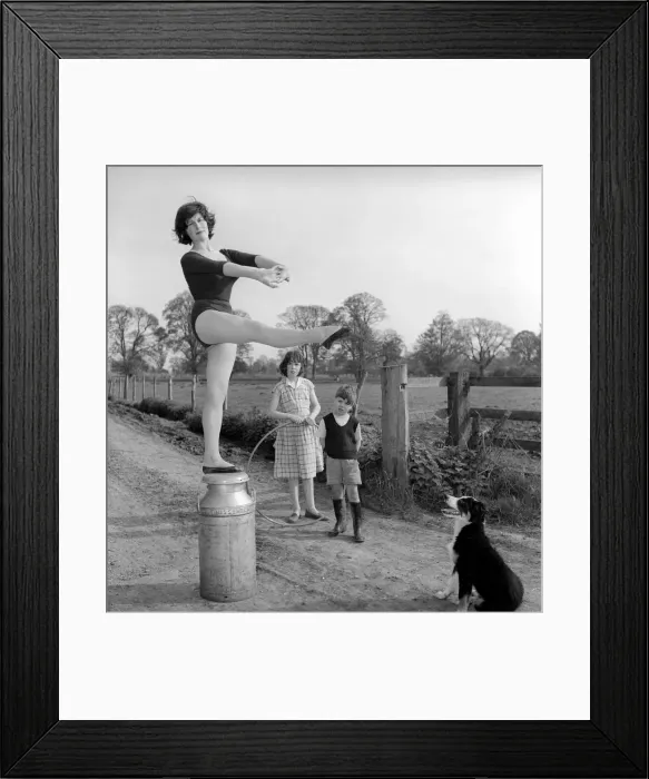 Framed Print : Dancing on the farm Ballerina Gillian Brodie seen here performing on fence posts