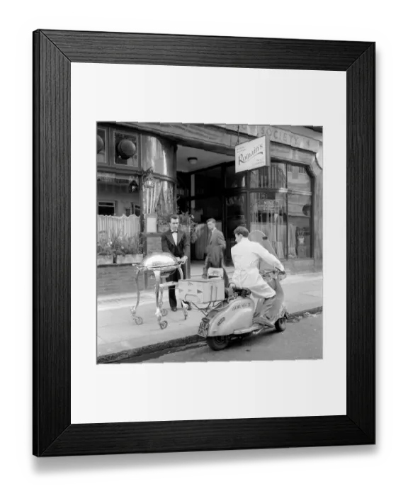 Framed Print : Meals on Wheels: The head waiter of the Romains Buttery loads up the restaurants