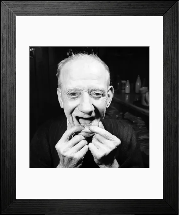 Framed Print : Pensioner with a new tooth. 77 year old man (George Berry) shows off his new tooth