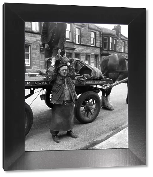 Coalman delivering coal. May 1958 A687-007