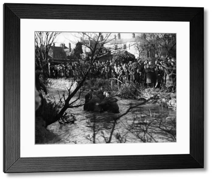 Framed Print : Some tense moments during the game'as the players surge in the stream Framed Print : Some tense moments during the game'as the players surge in the stream
